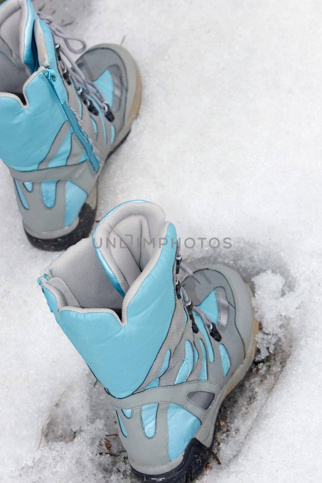 Close-up of ski boots in snow