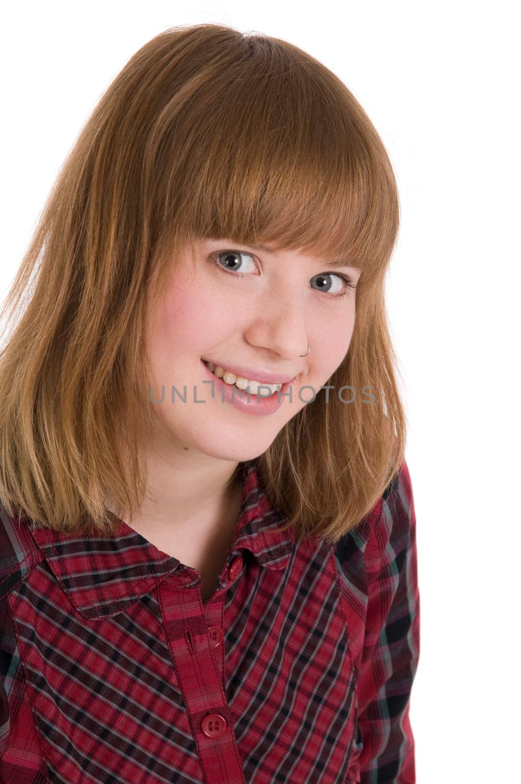 Head-and-shoulder portrait of a young woman in a checked blouse against white background.