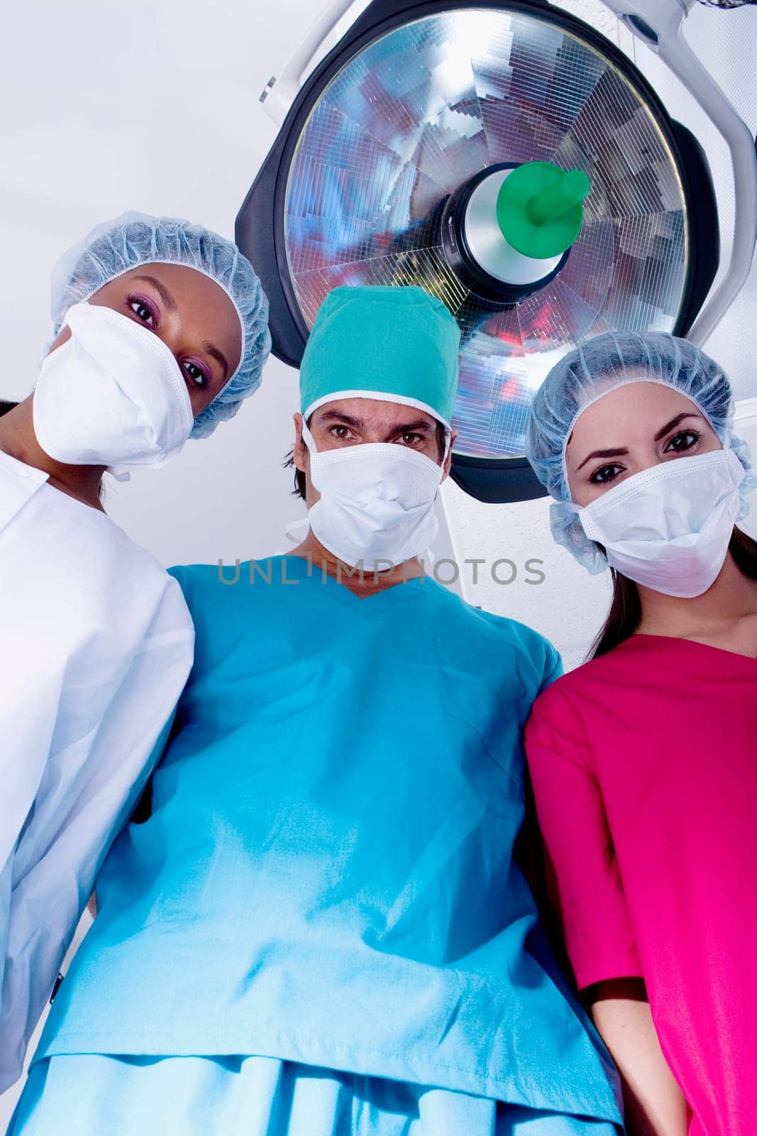 Low angle view of surgeons in an operating room