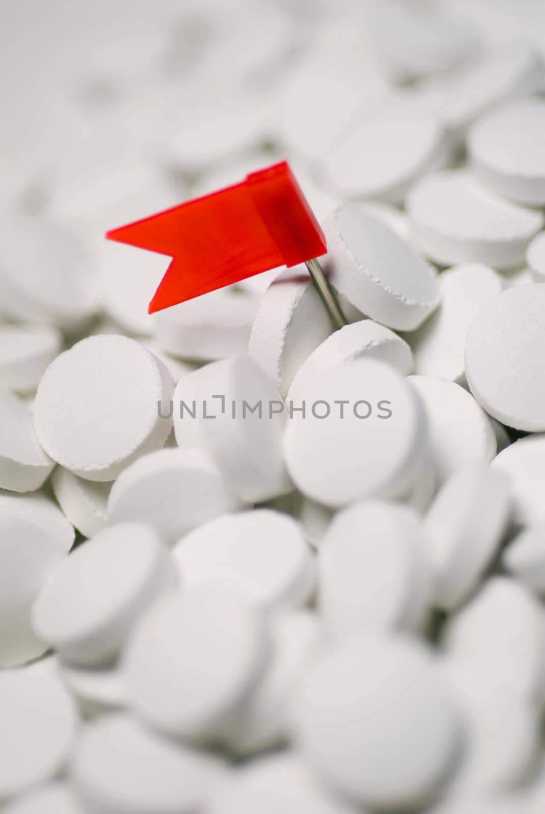 Close_up of a flag on the heap of pills