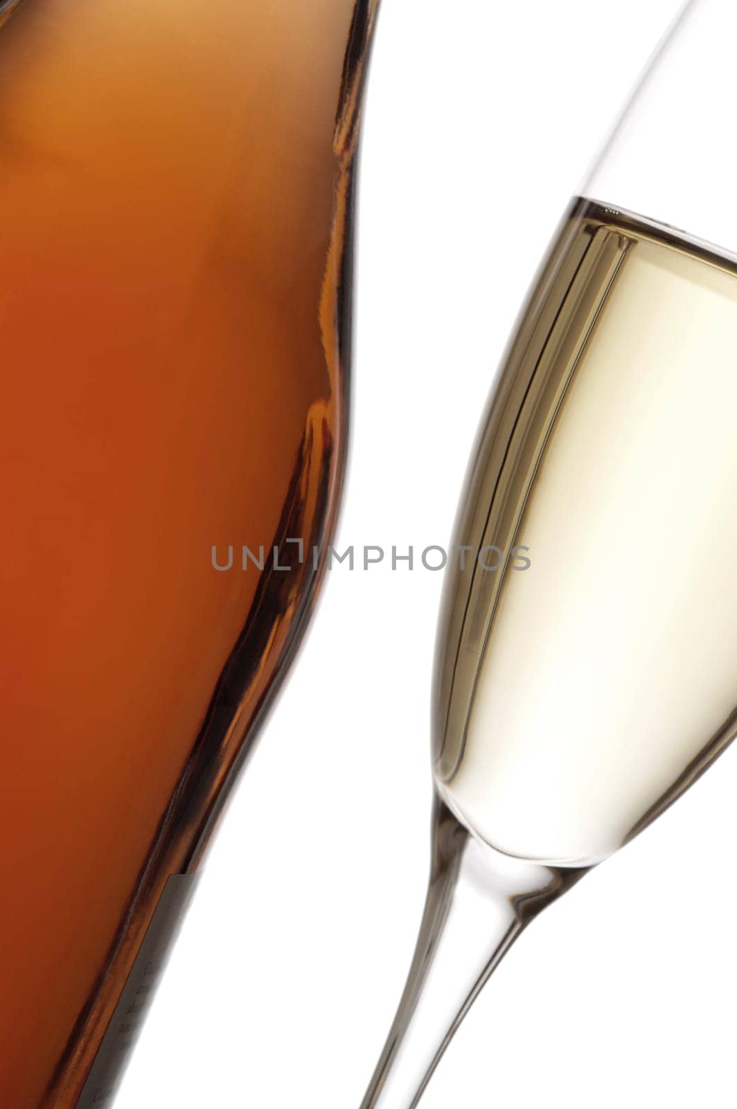 Close-up of a glass of wine with a wine bottle