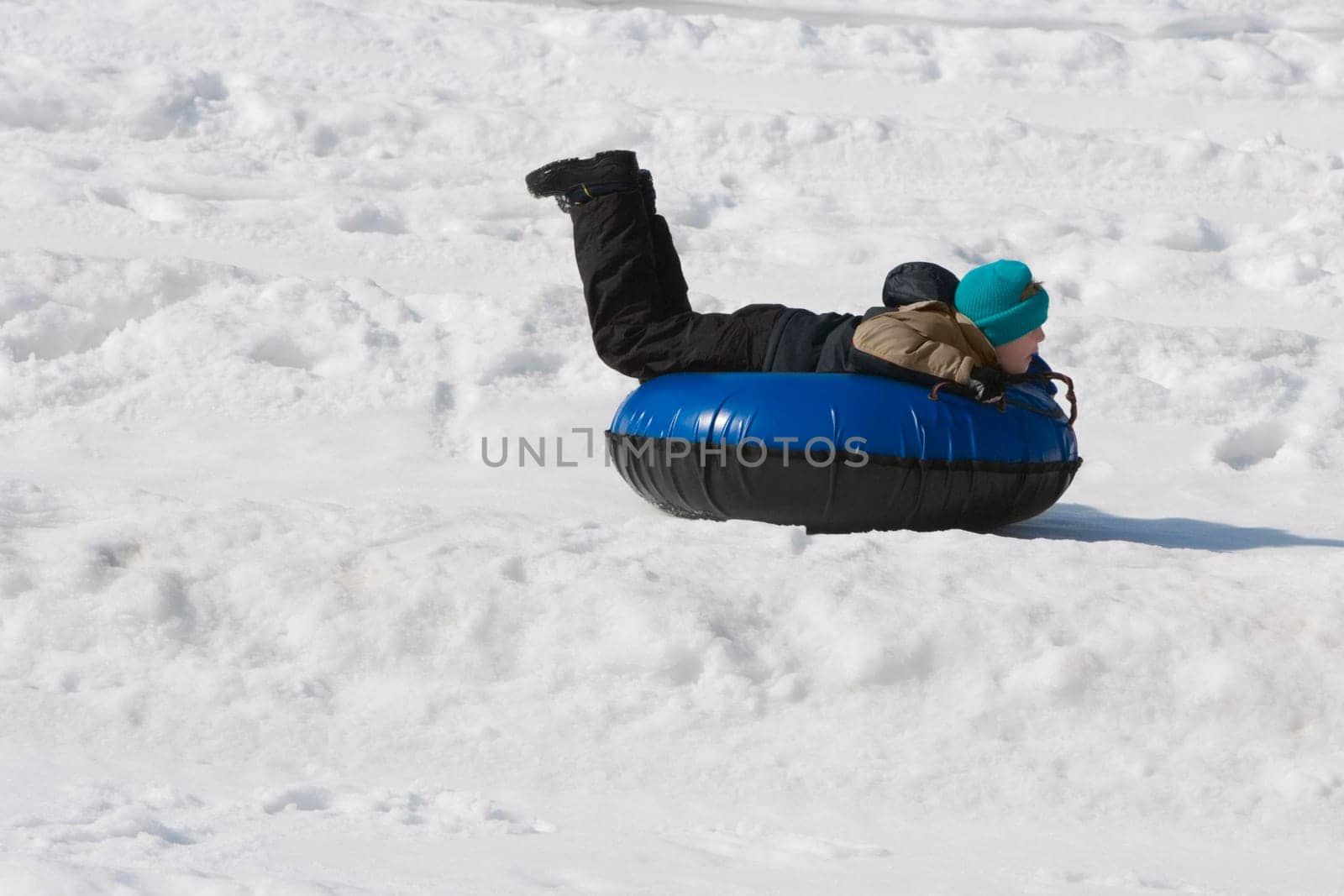 Side profile of a child lying on an inflatable ring