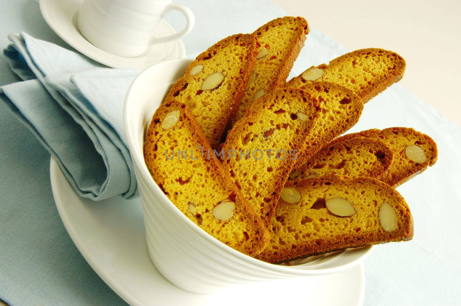 Close-up of slices of almond cake in a bowl