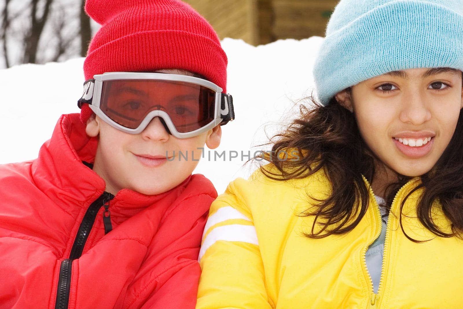 Portrait of a boy and a teenage girl smiling