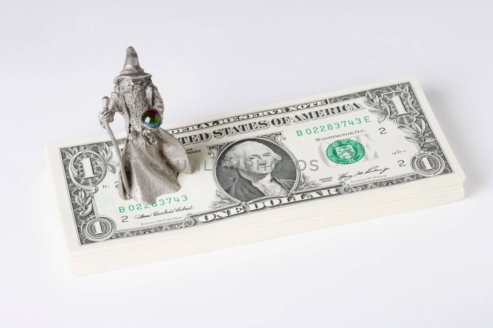 Figurine of a fortune teller on US paper currency