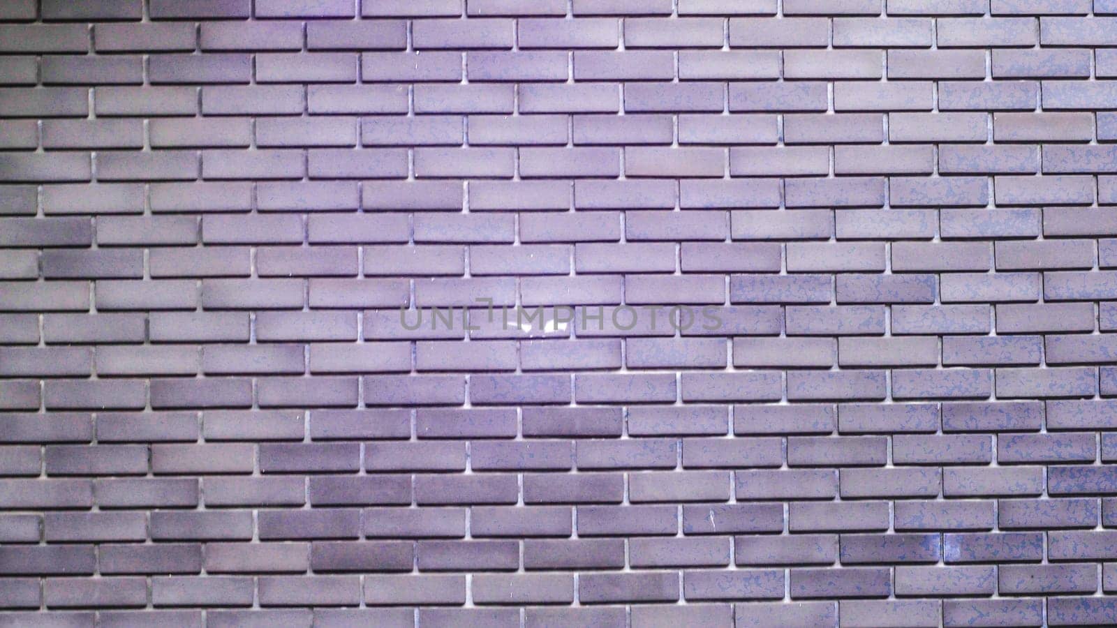 Pattern of grey natural stone wall texture and background. Interior decorative . Dark brown brick wall, creative back-phonon, close-up