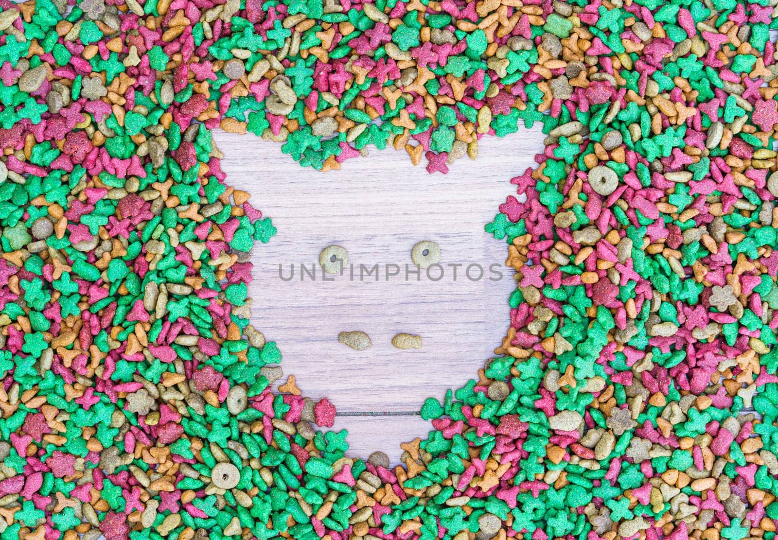 Top view dry cat food on wooden background with copy space