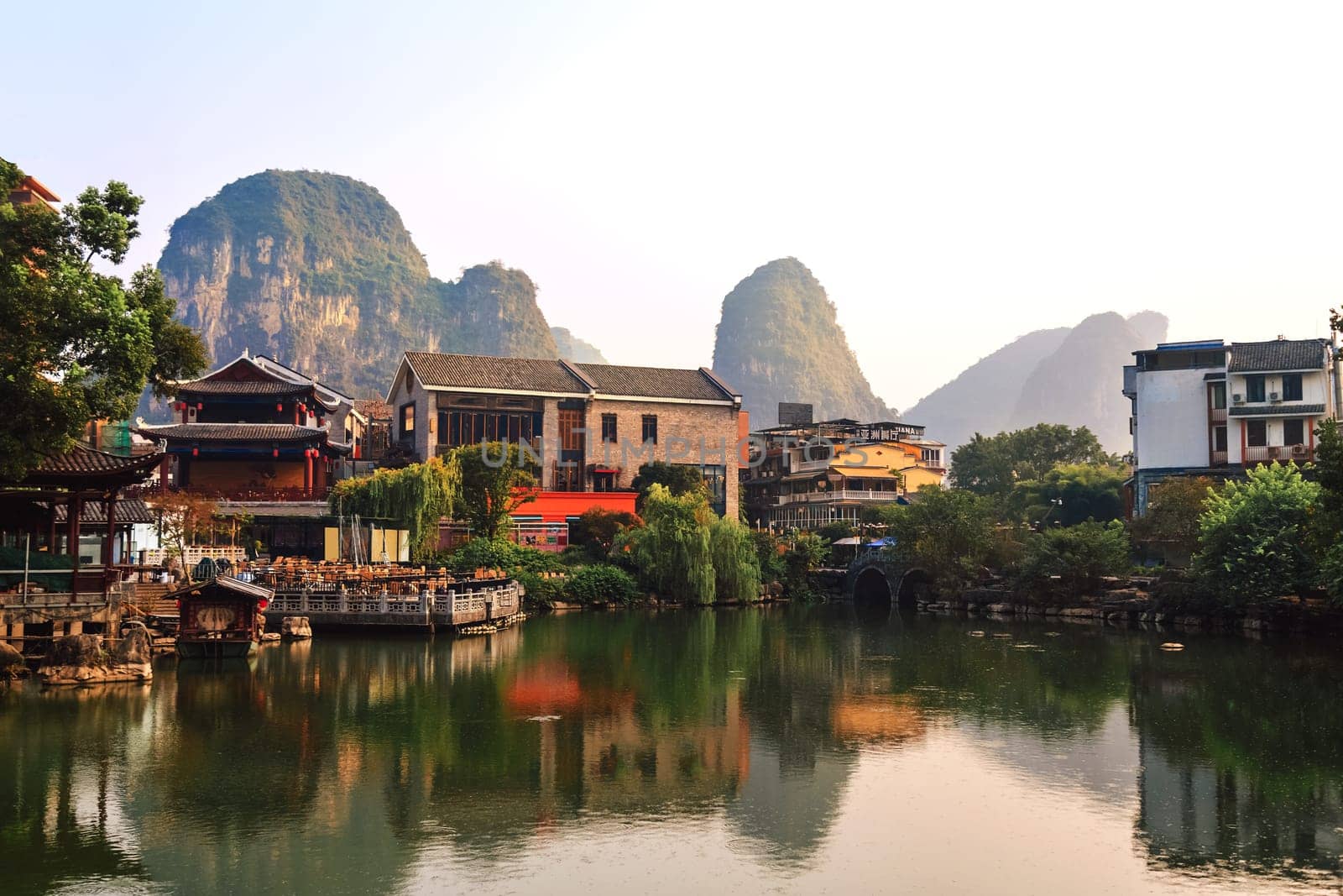 View of the cityscape by the lake among the mountains, Guilin, China on August 24, 2019 on a bright sunny day