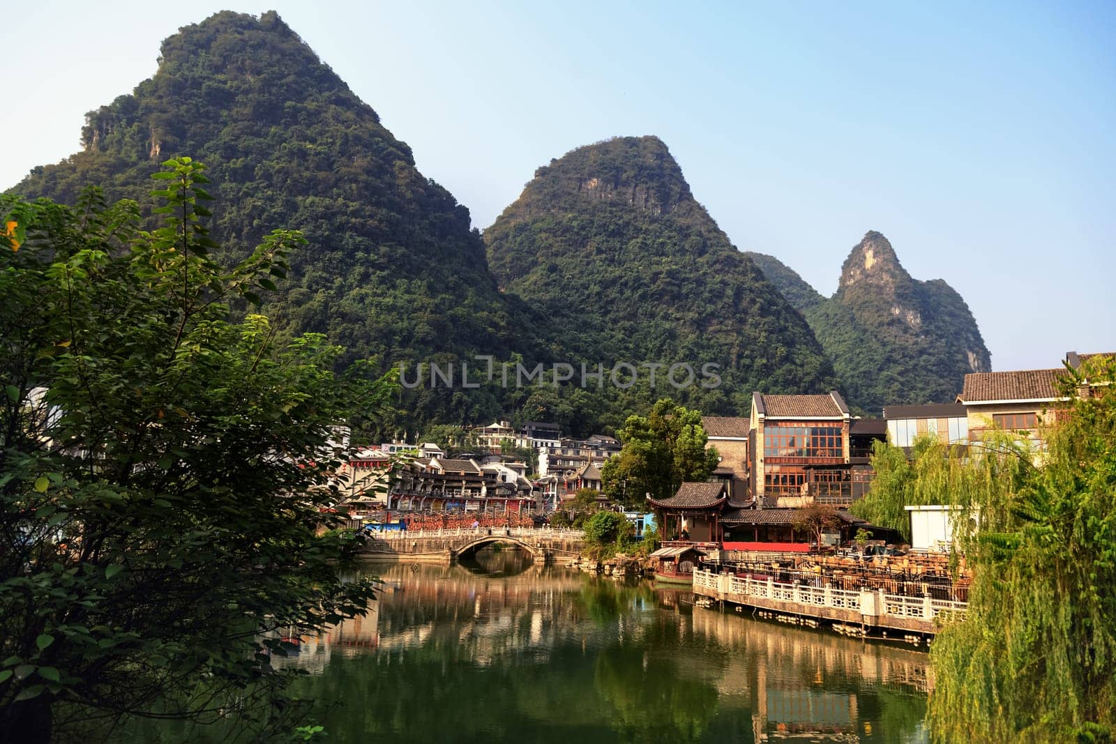 View of the cityscape by the lake among the mountains, Guilin, China on August 24, 2019 on a bright sunny day