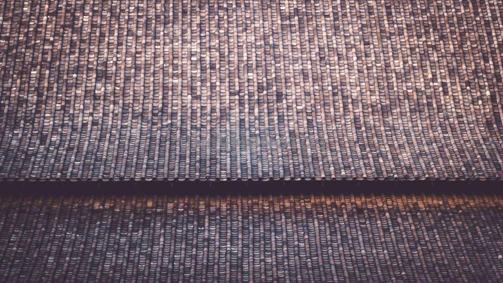 The Chinese Roof Tiles with Curve Design. The clay roof of a Japanese temple .material of traditional Asian architecture pattern texture background