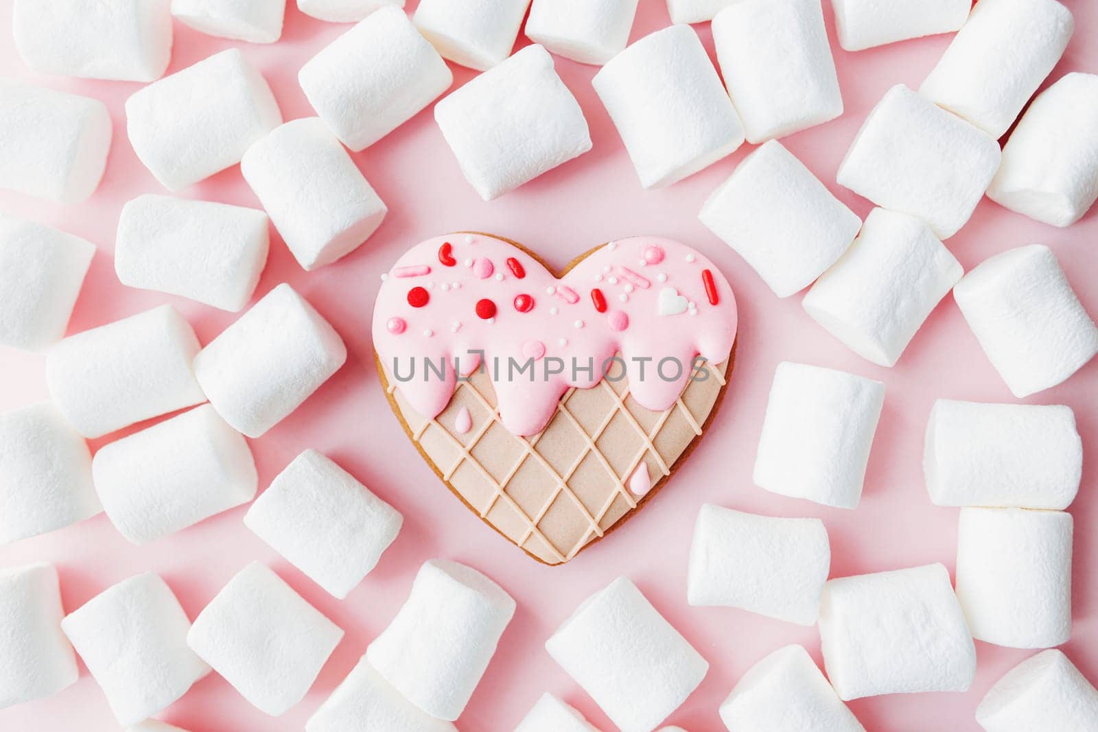 Melt ice cream heart gingerbread cookie, marshmallow. Valentine. Pink background. High quality photo