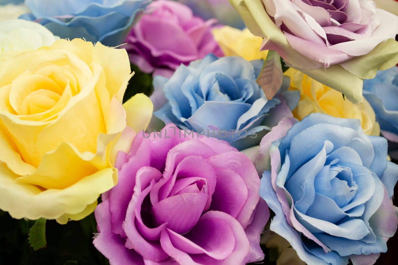 Closeup of artificial colorful roses flower bouquet.