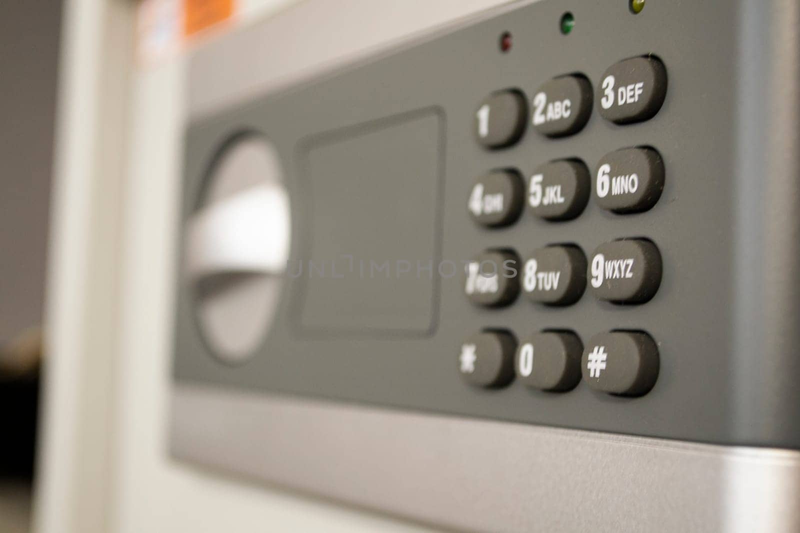 Safe lock code password pad number protection safety box bank closeup