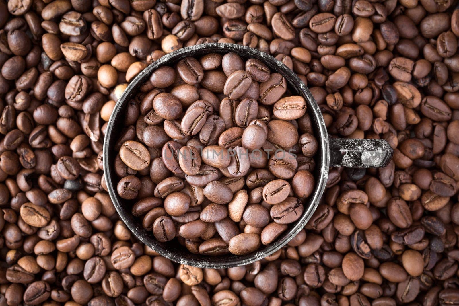 Cup of coffee on coffee beans background