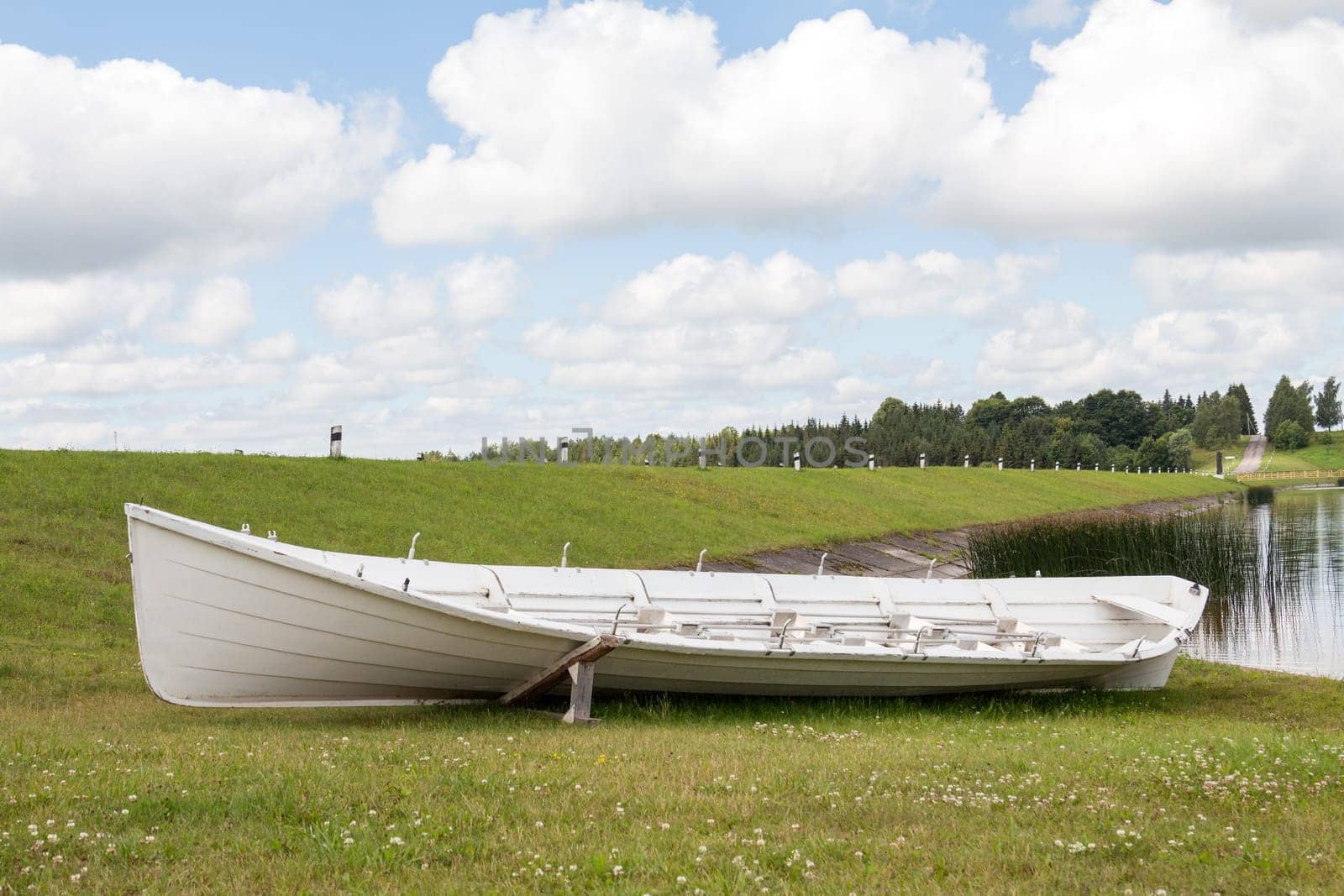 Long wooden boat on the lake shore