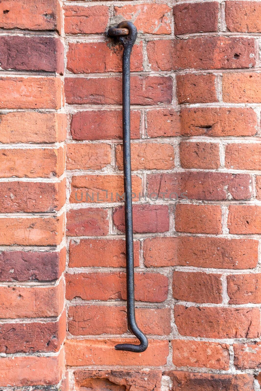 Rusted metal hook attached to wall