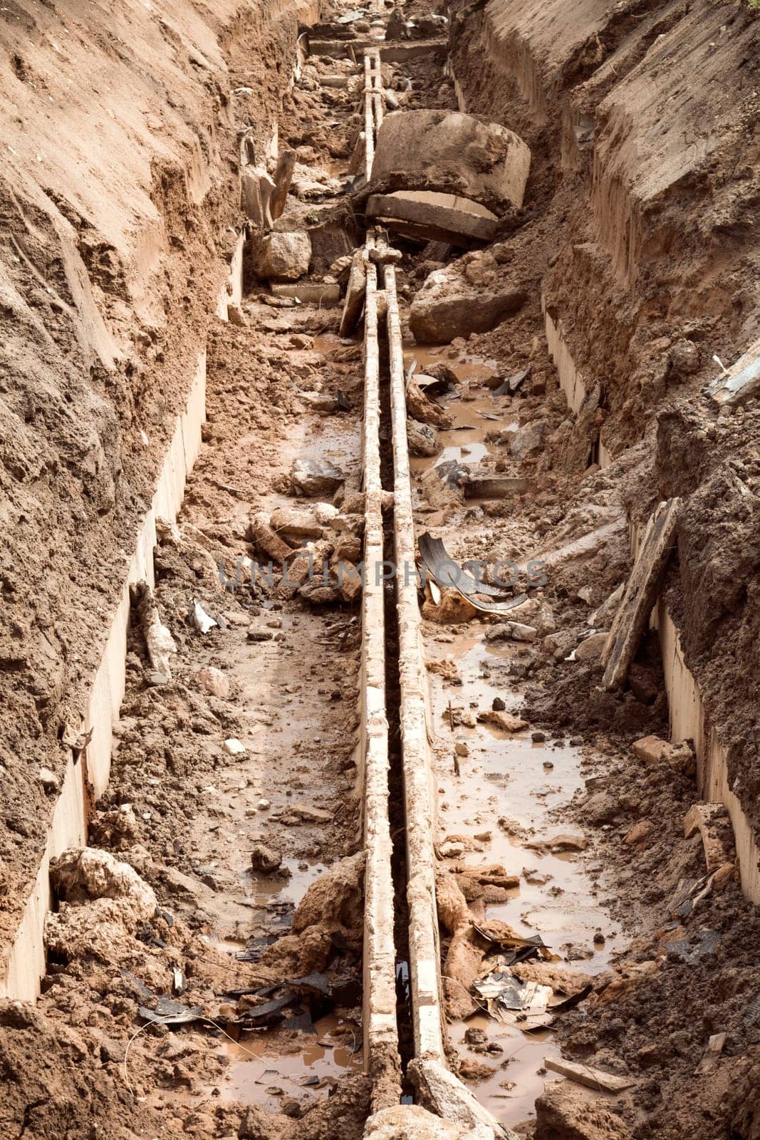 Empty trench of engineering heating systems.Reconstruction procces.