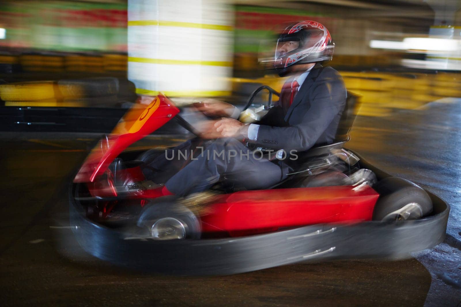 Brave businessman racing in go-kart