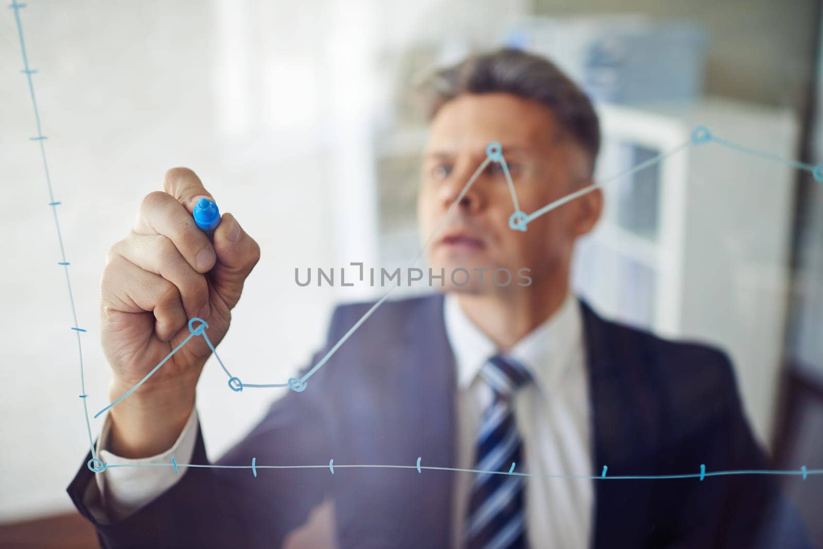 Confident man writing graph