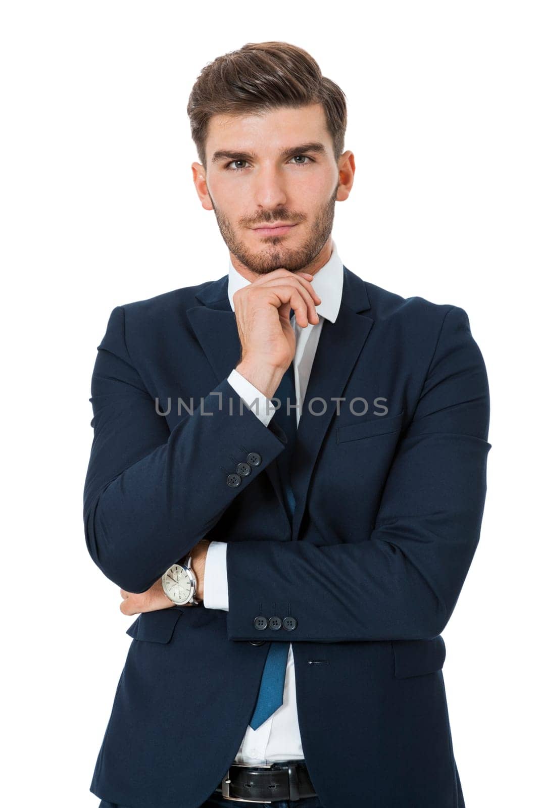 Successful young businessman standing in a relaxed pose with open jacket isolated on a white background