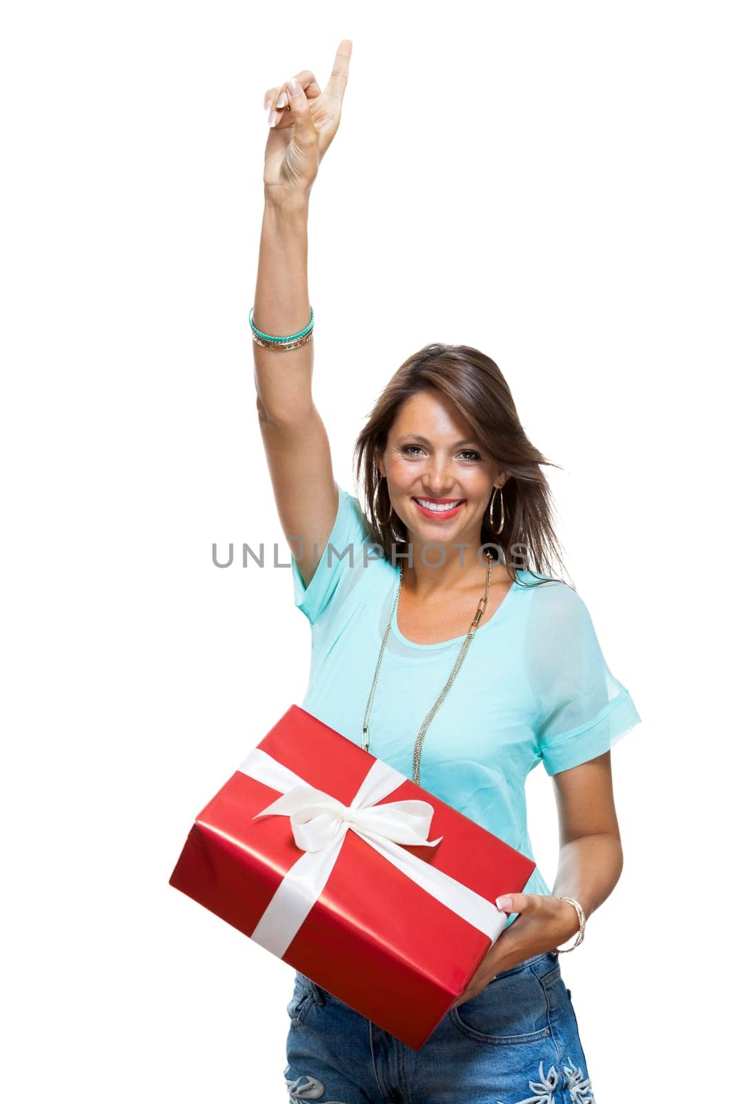 Happy attractive young woman with red gift with white bow Cheerfully isolated against white background with text space