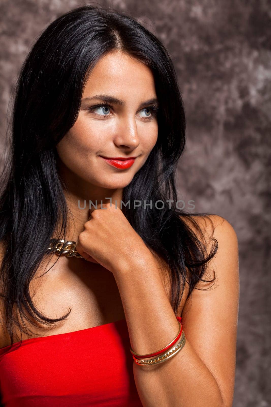 Young pretty girl woman with long black hair in red top as portrait with text space