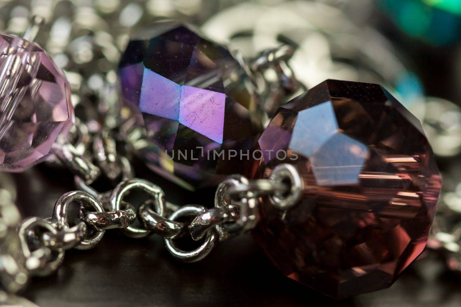 Jewellery fashion jewellery with colored beads as close-up on dark background