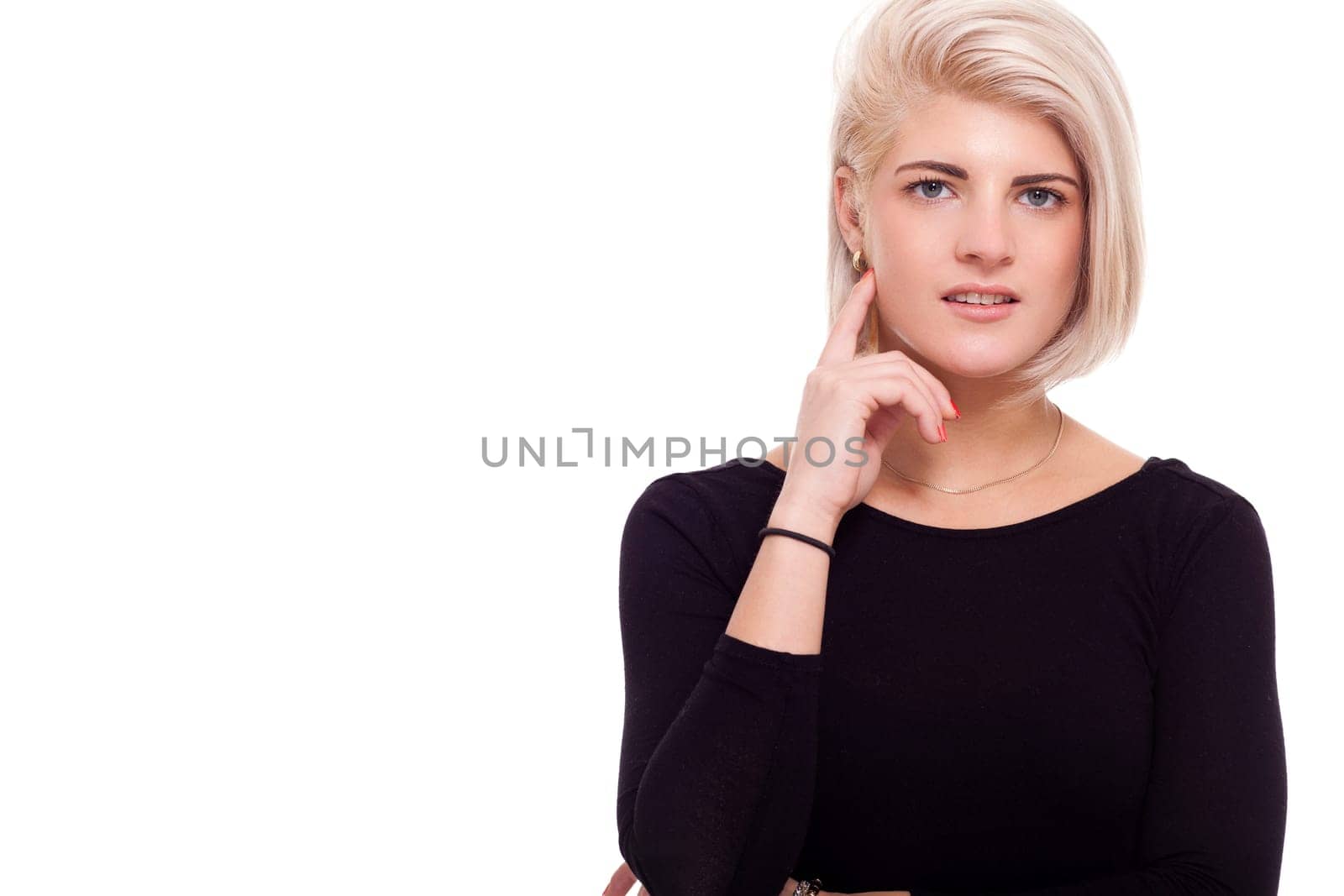 Young attractive woman in black top looks straight into the camera portrait Isolated aud white background