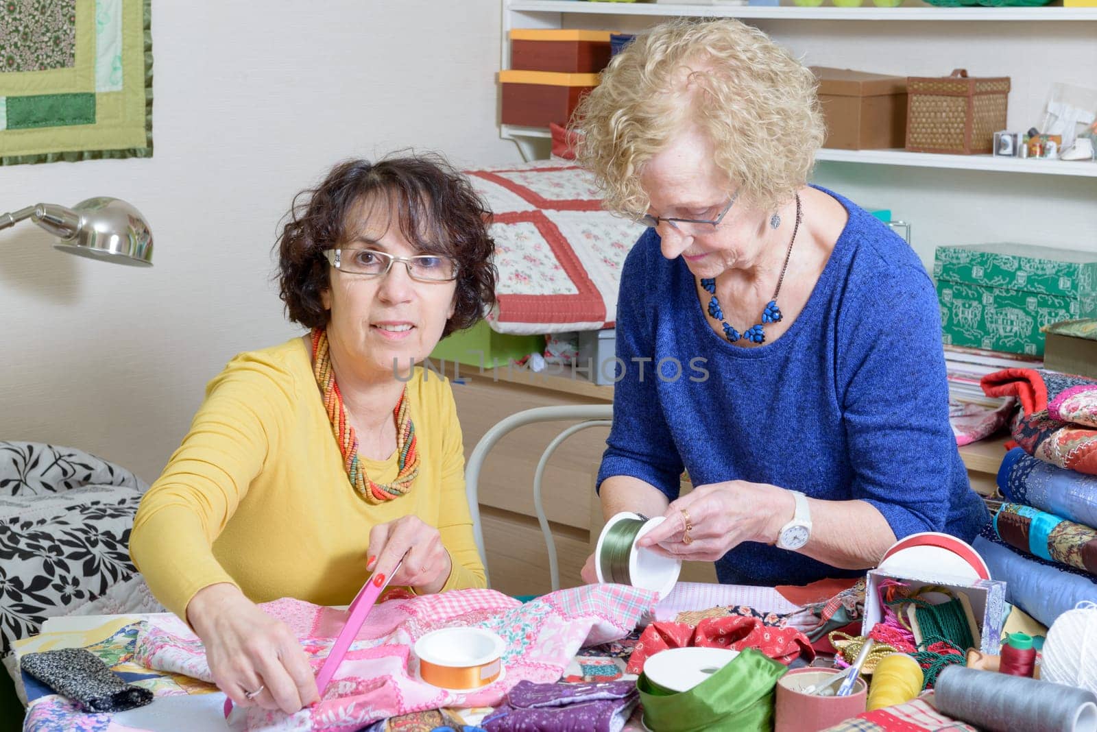 two women working on their patchwork in the workshop