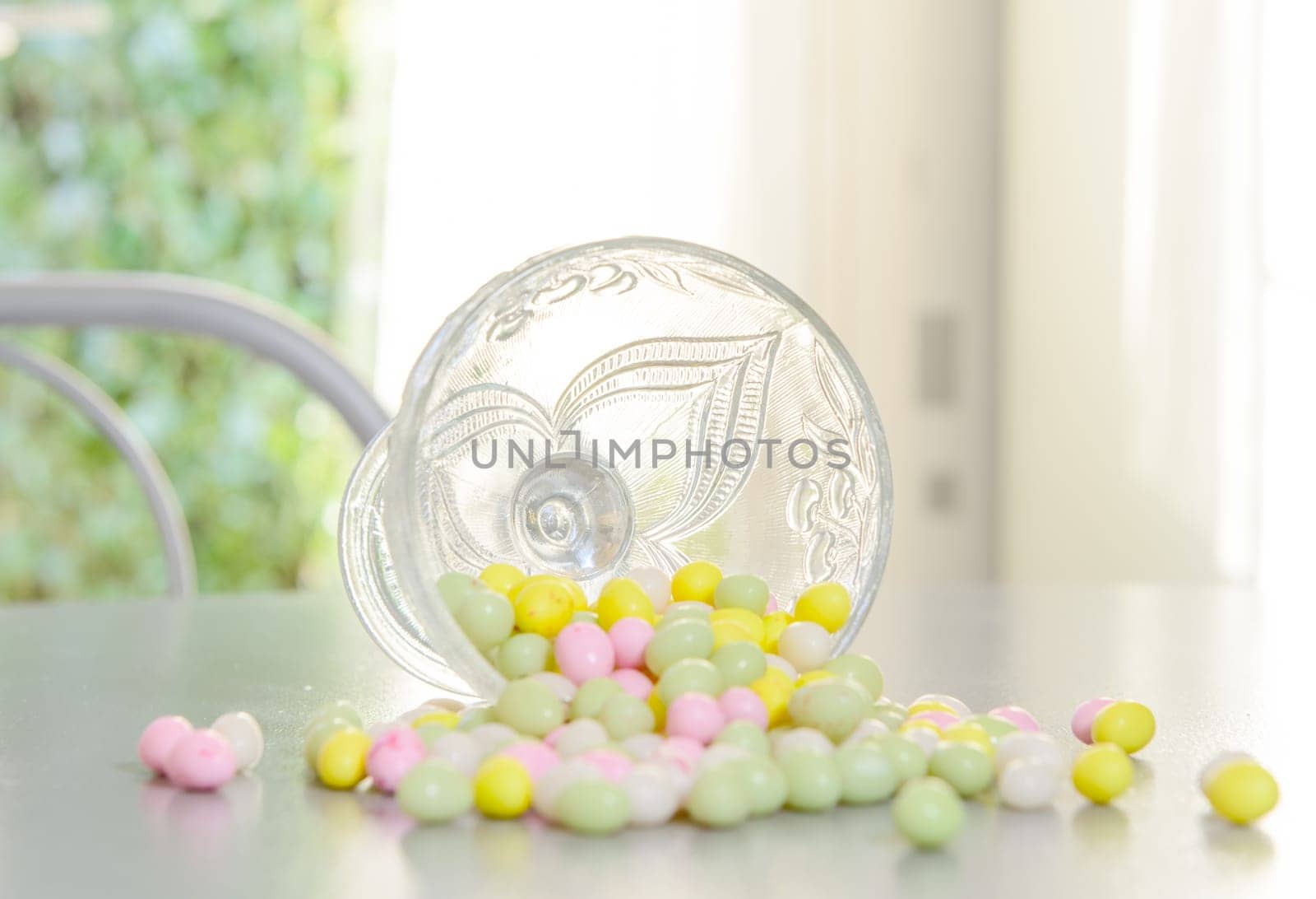 cup filled with candy for Easter reversed on table