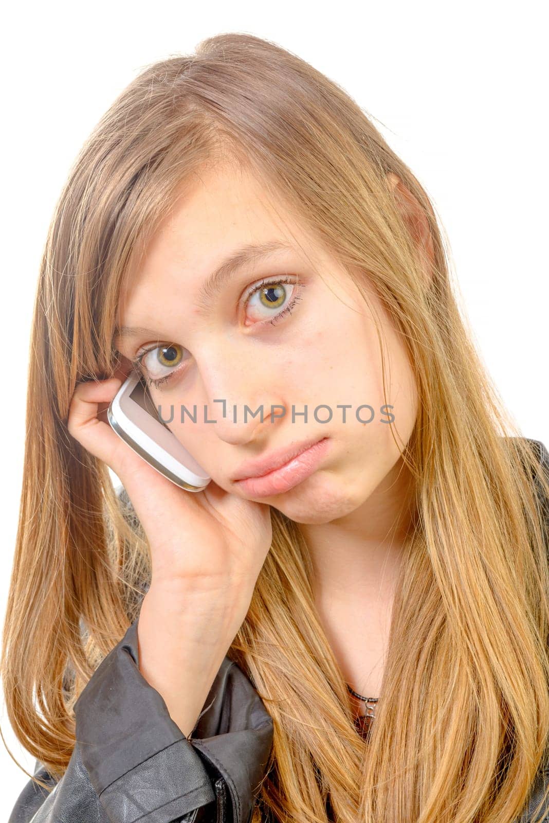 a teenage girl with a phone is unhappy