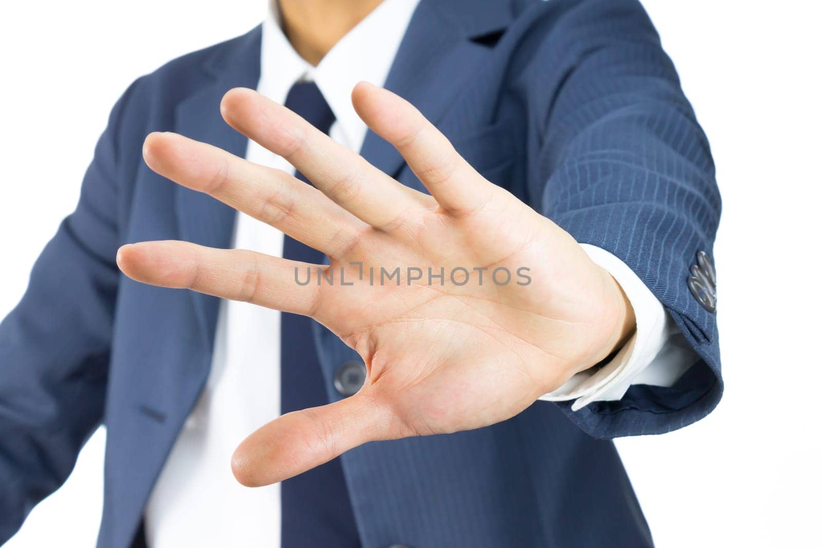 Businessman in Blue Suit Show Stop Sign of Hand on Tilt View Isolated on White Background. Concept about Stopping or Prevent.