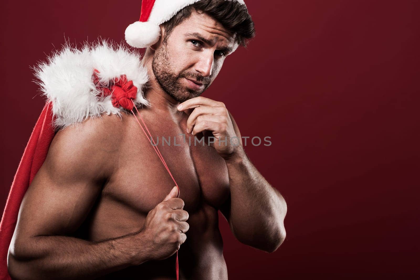 Santa claus with sack full of christmas presents