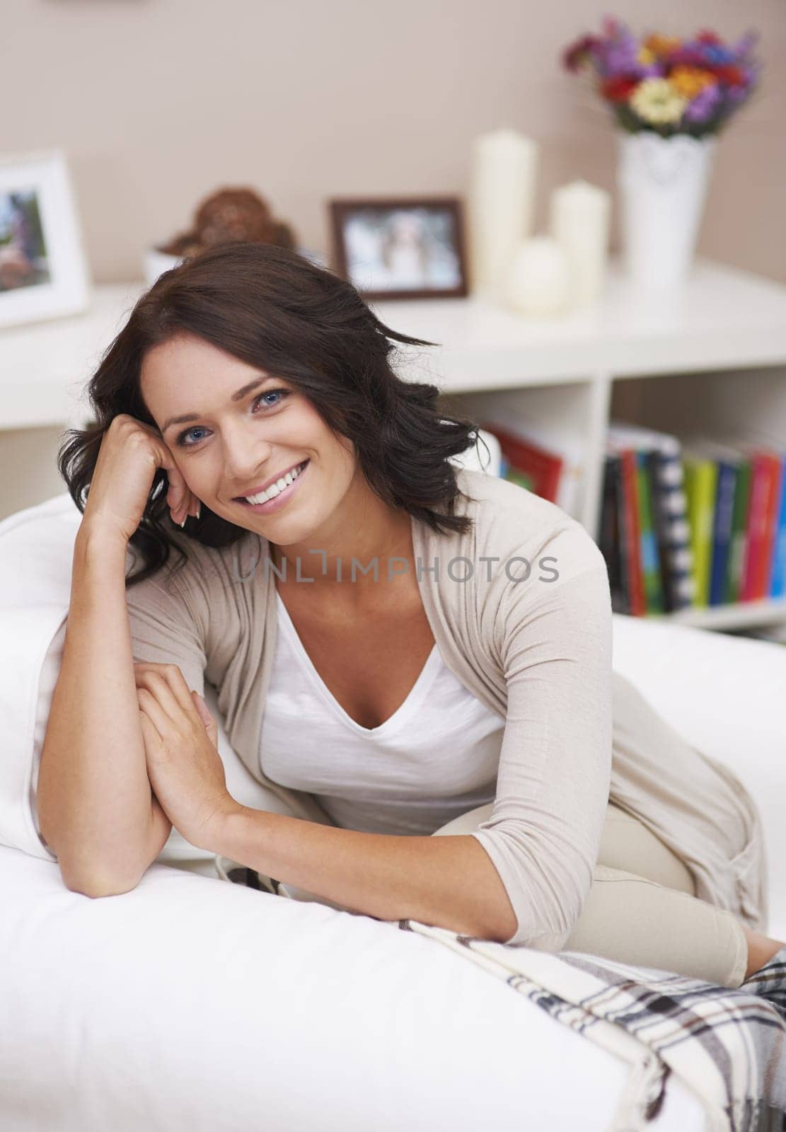 Attractive young lady relaxing on comfortable chair