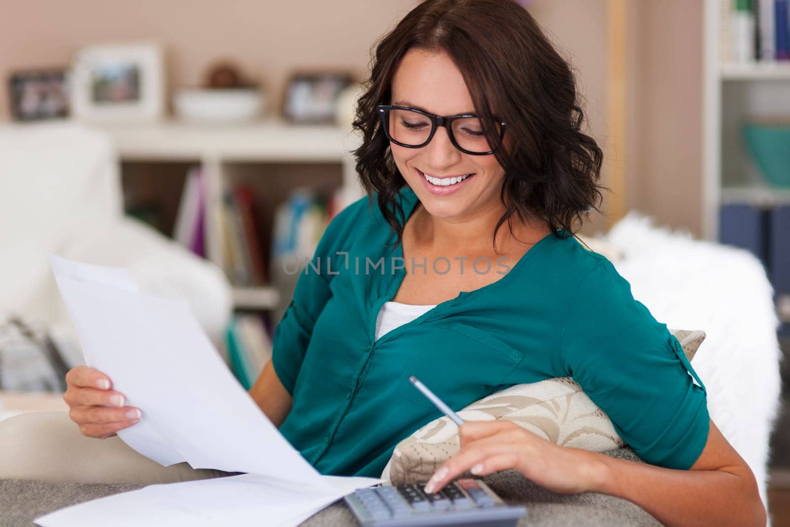 Monthly bills payments by young woman