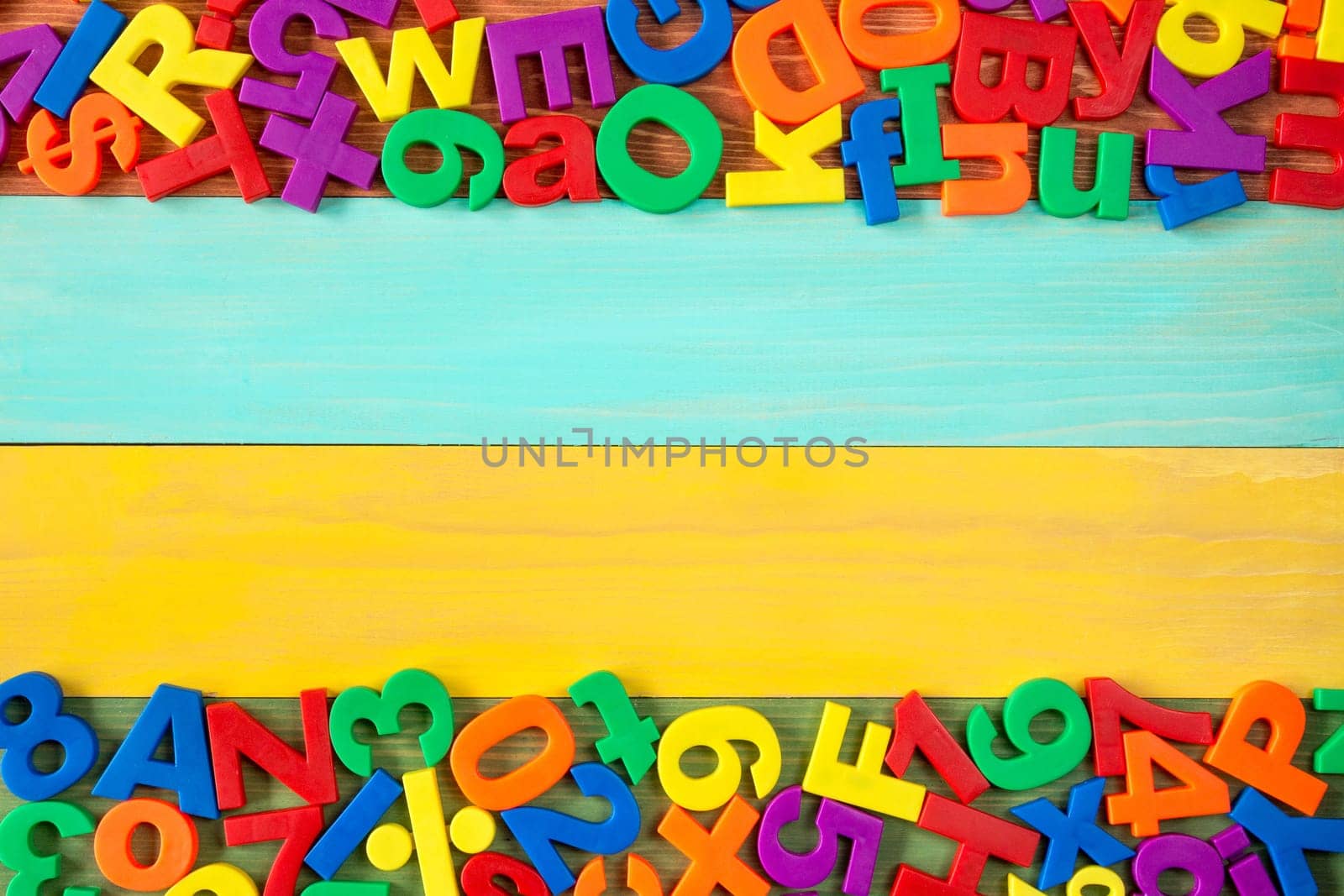 Border of colorful fridge magnets with copy-space