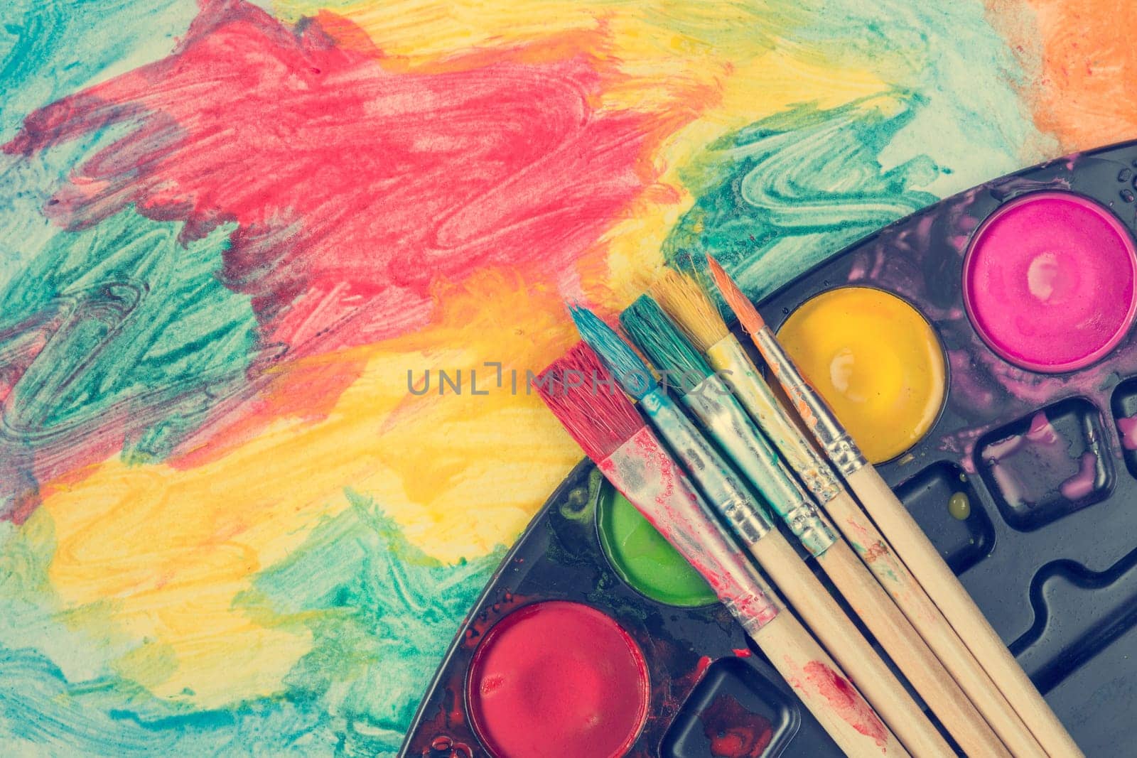 Set of watercolor paints and paintbrushes for painting.Top view.