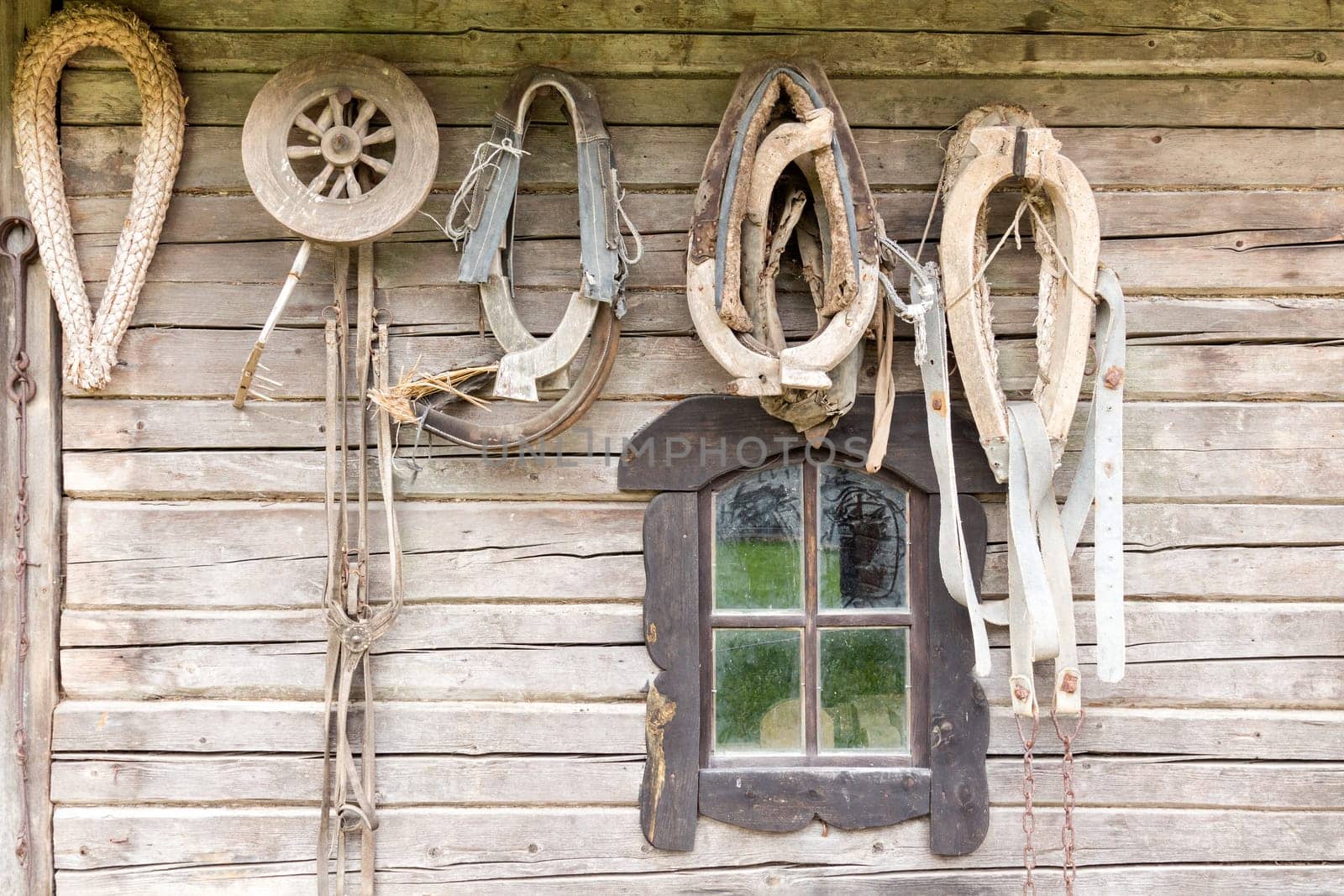 Old wooden house wall with old tools and stuff