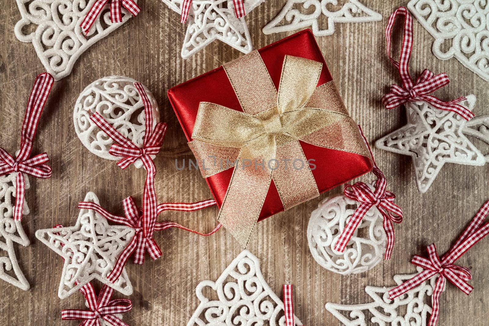 Gift box and christmas decorations on wooden table