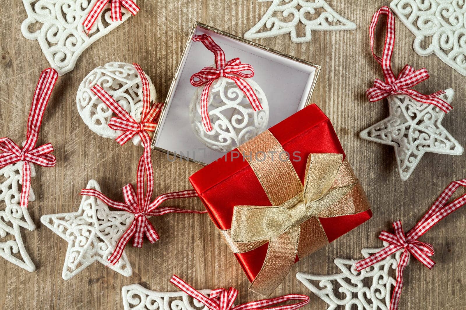 Giftbox and christmas decorations on wooden table