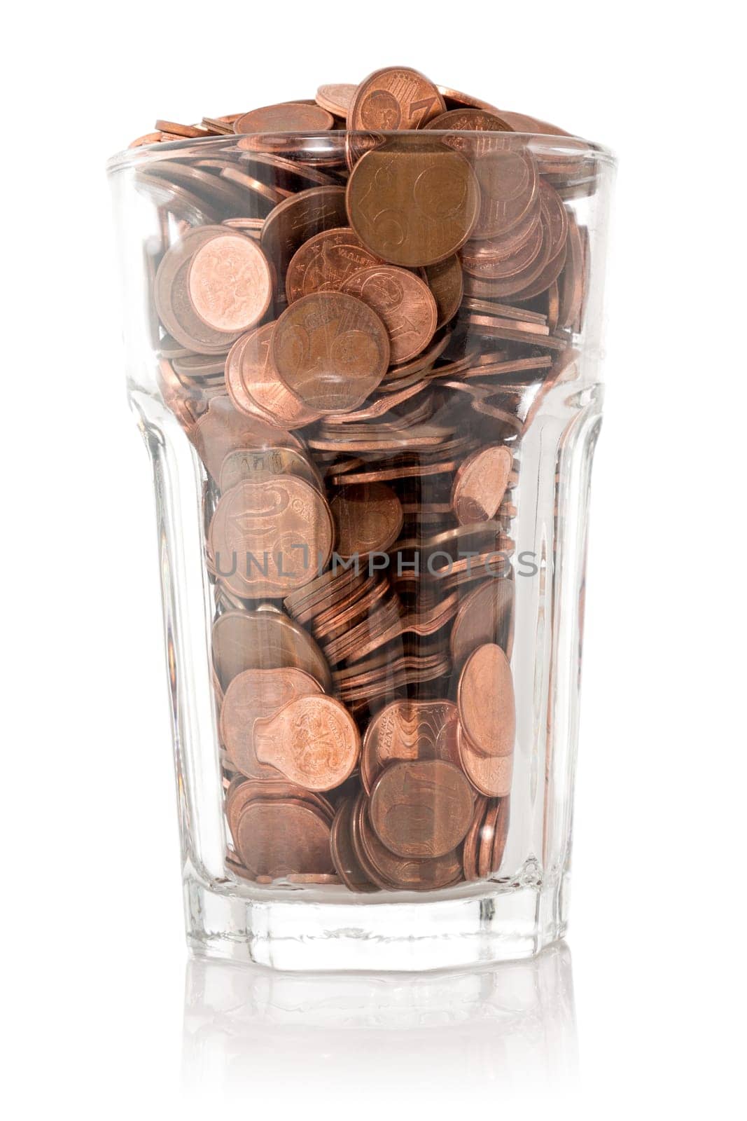 Saving money, glass full of coins, isolated on white background