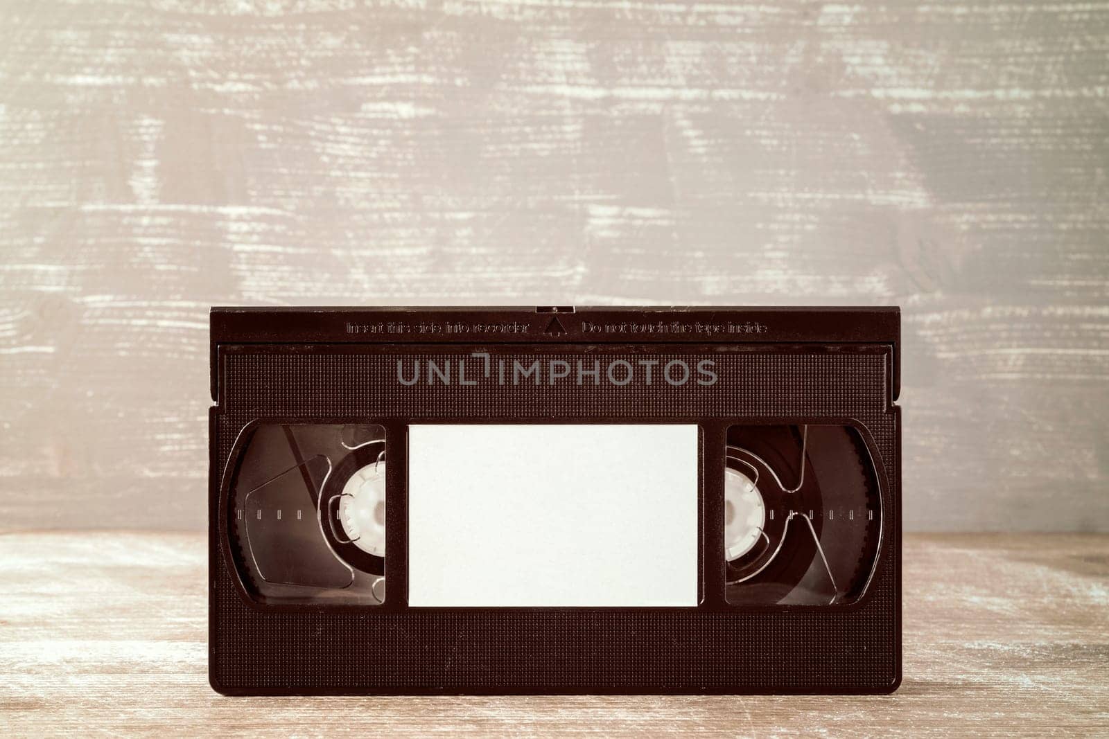 Video tape cassette with blank label for copy-space
