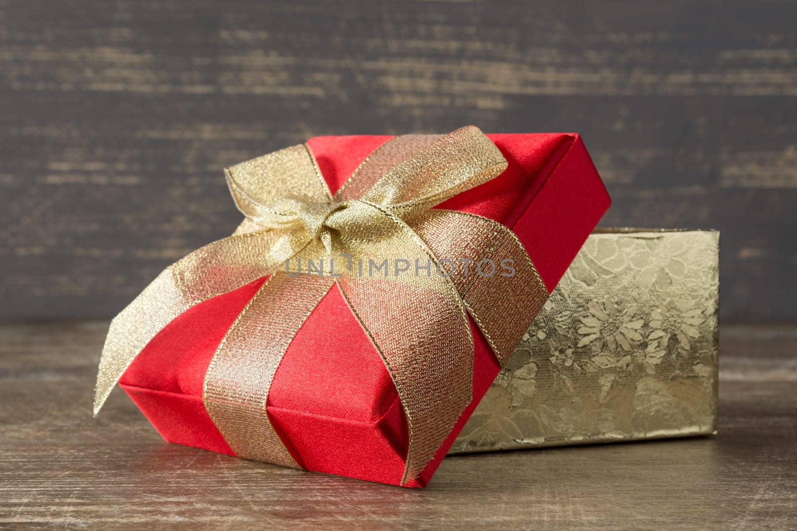 Holidays concept. Present box on wooden background.
