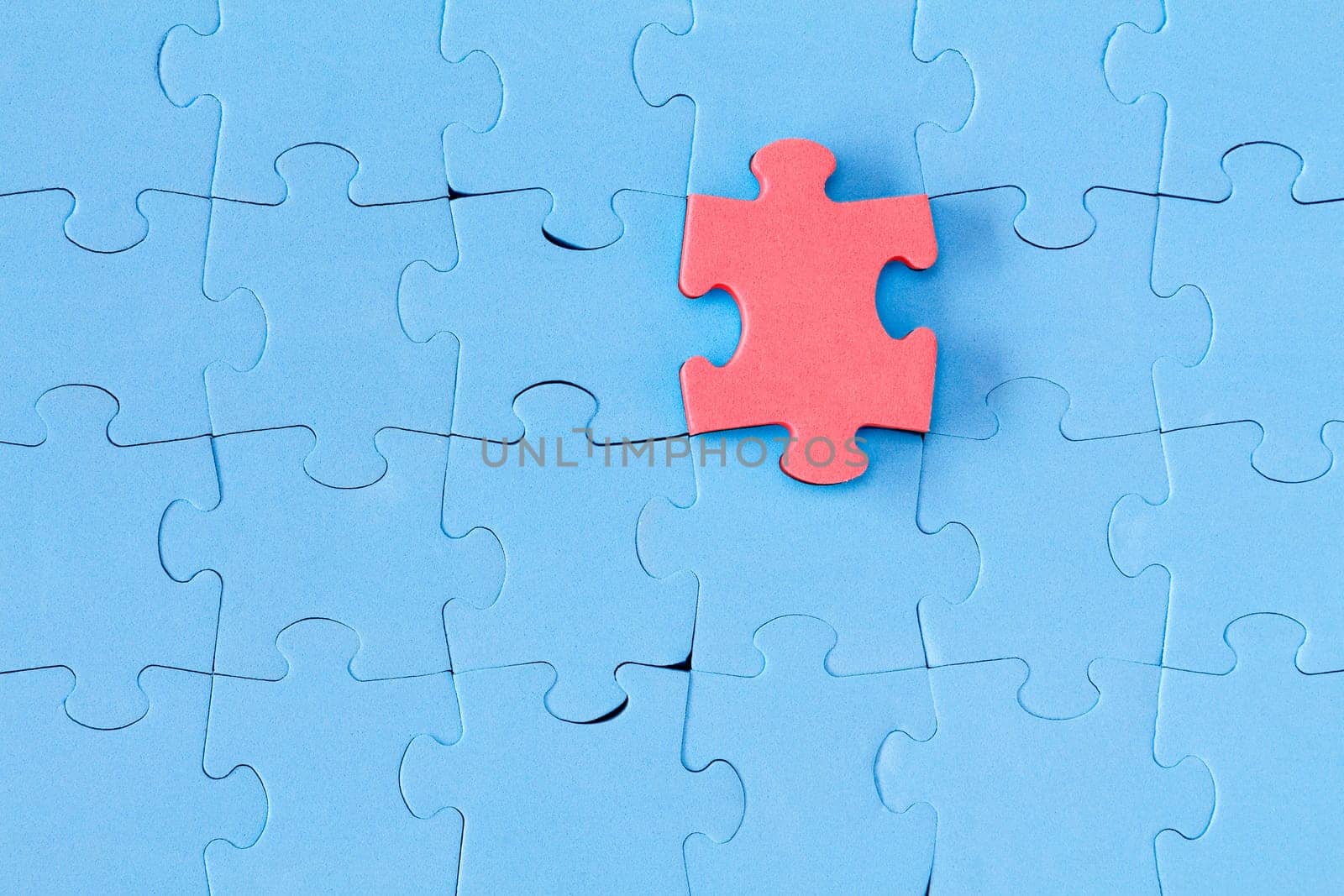 Jissaw puzzle. Stand out from the crowd concept
