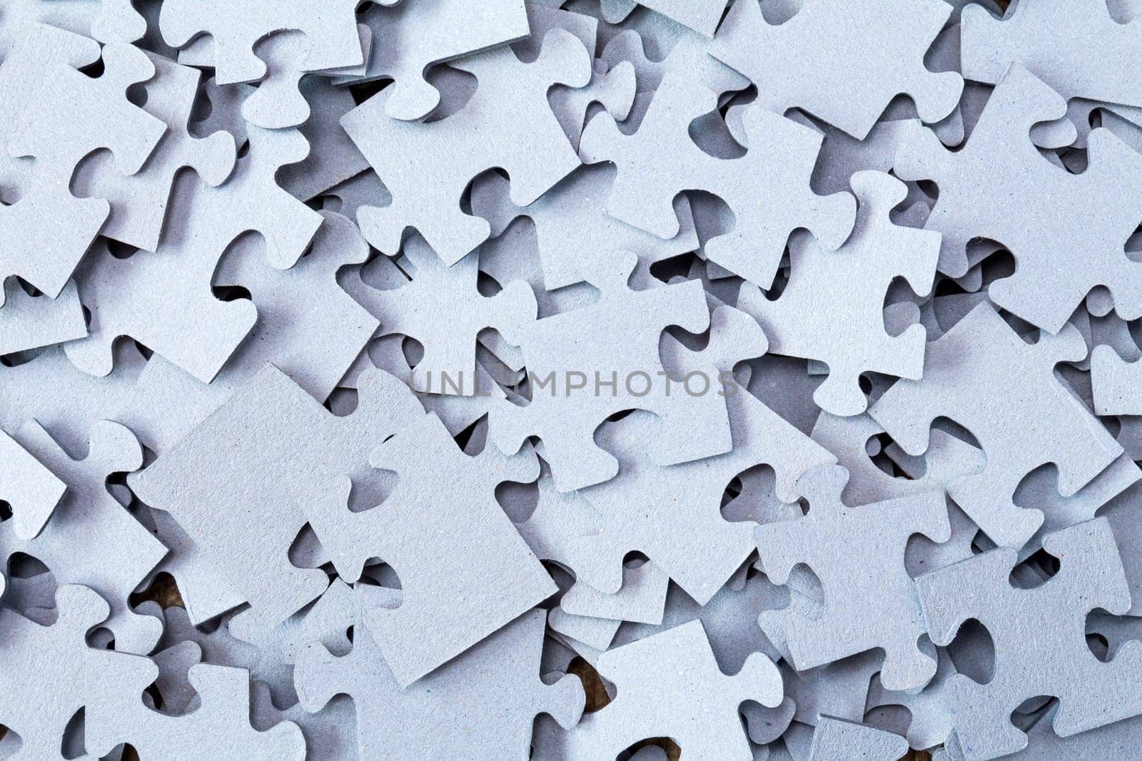 Pile of Blue Blank Puzzle Pieces Background.