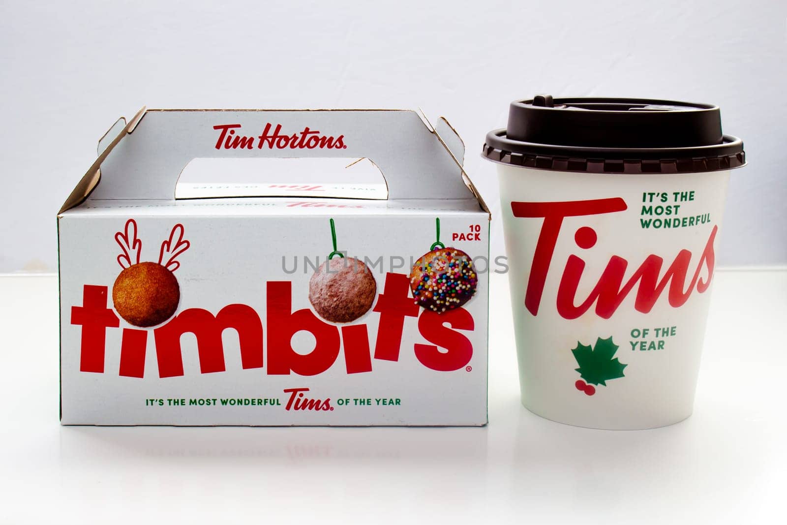 Calgary, Alberta. Canada. Jan 29, 2021. Christmas Tim Hortons coffee and Timbits box on a white background