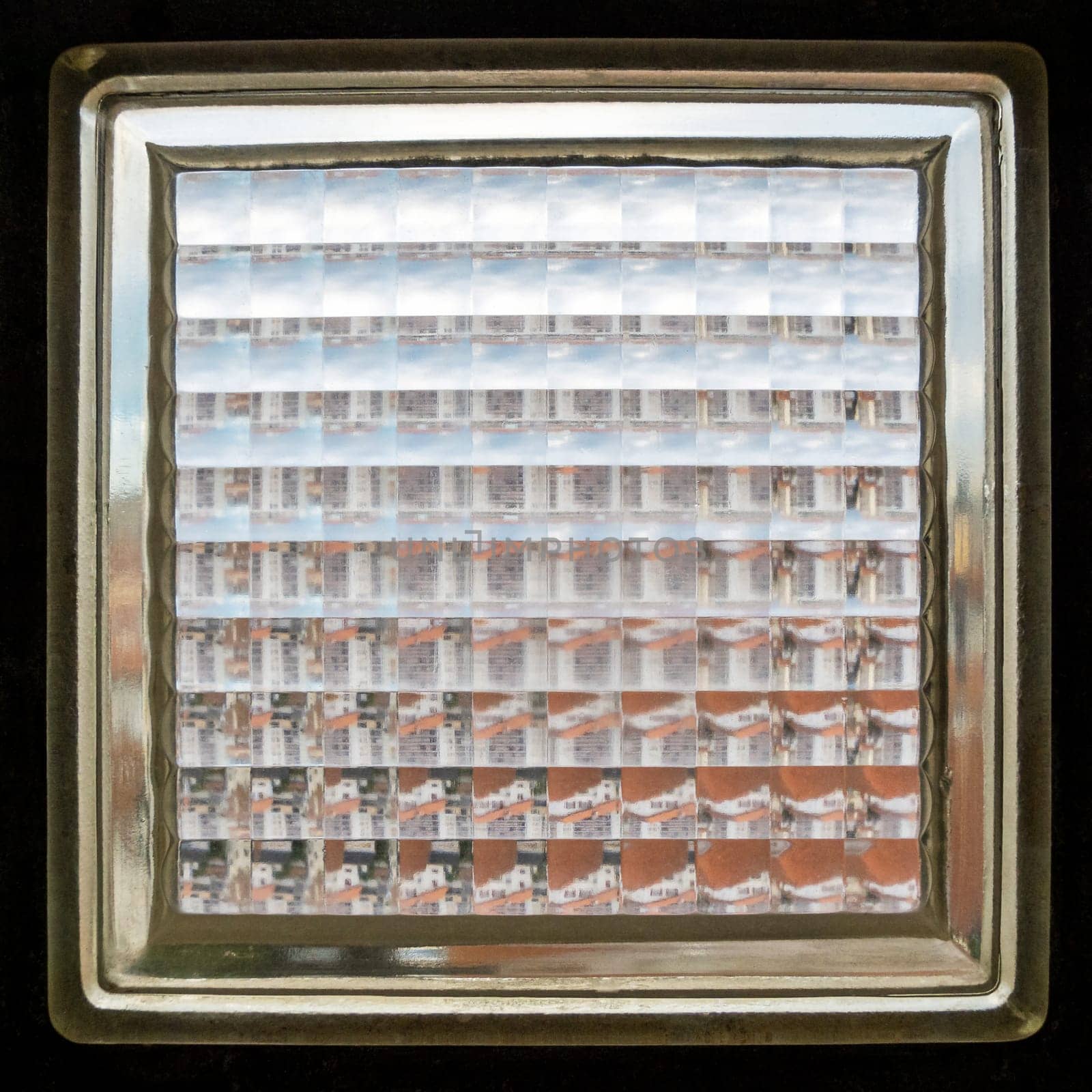 Closeup shot of a glass brick also known as glass block texture, abstract background, square crop