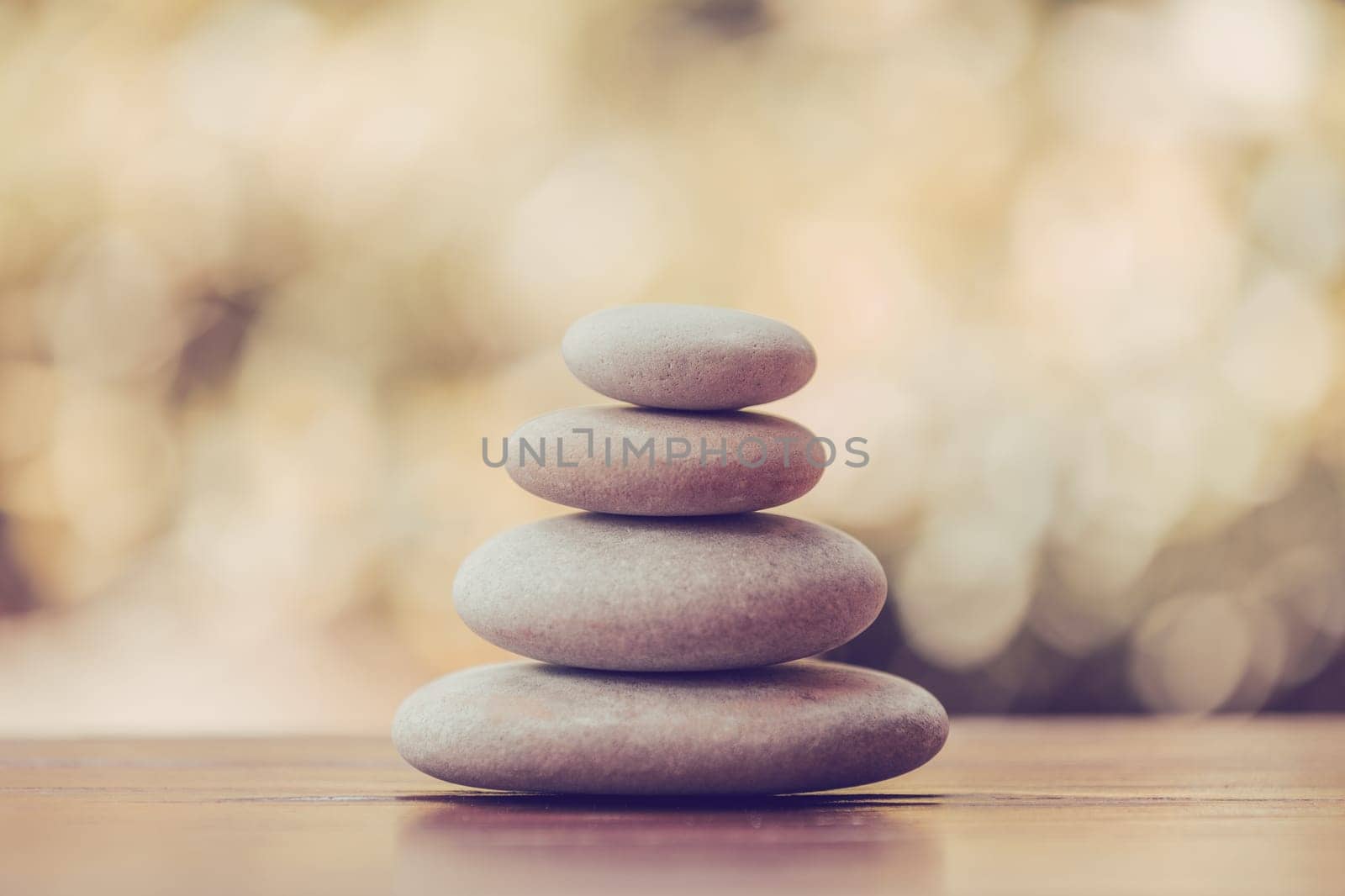 balancing pile of pebble stones, like ZEN stone, outdoor in springtime, spa wellness tranquil scene concept, soul equanimity mental calmness picture