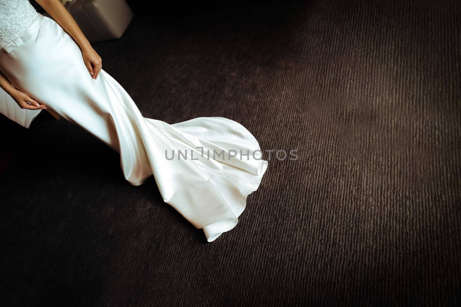 The bride's dress on the dark floor. Wedding.