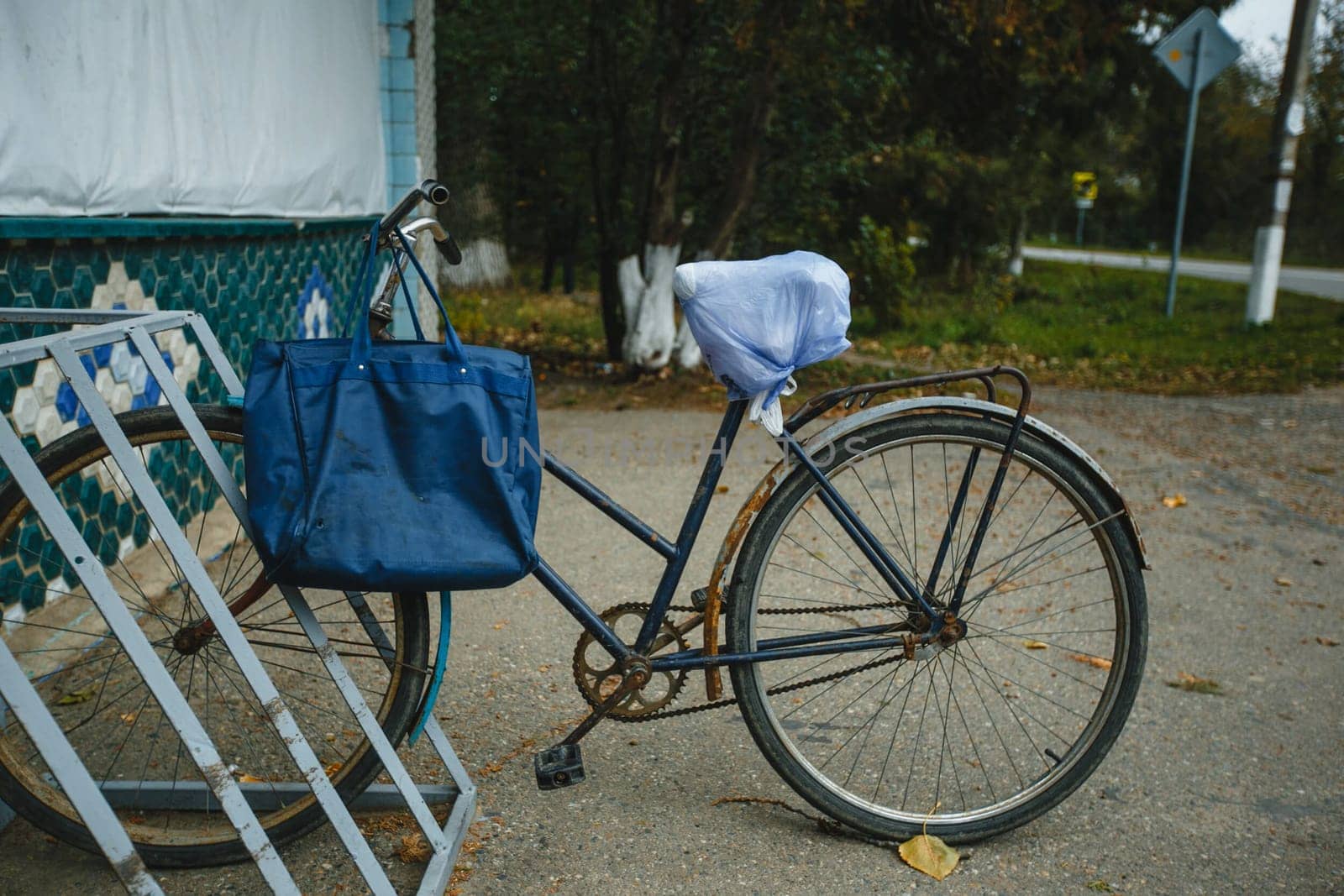 The bike is parked in the shop. An old bike.